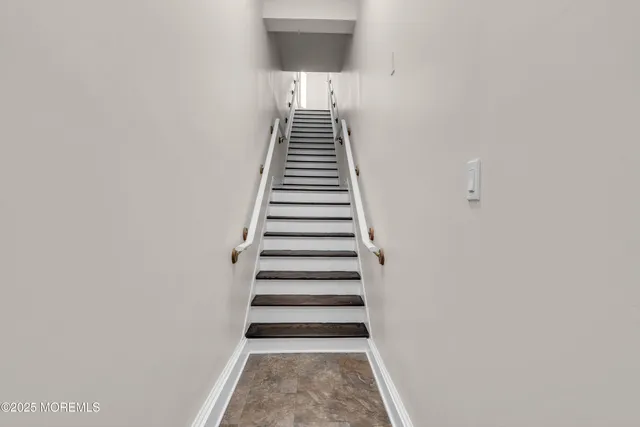 a view of a hallway with stairs