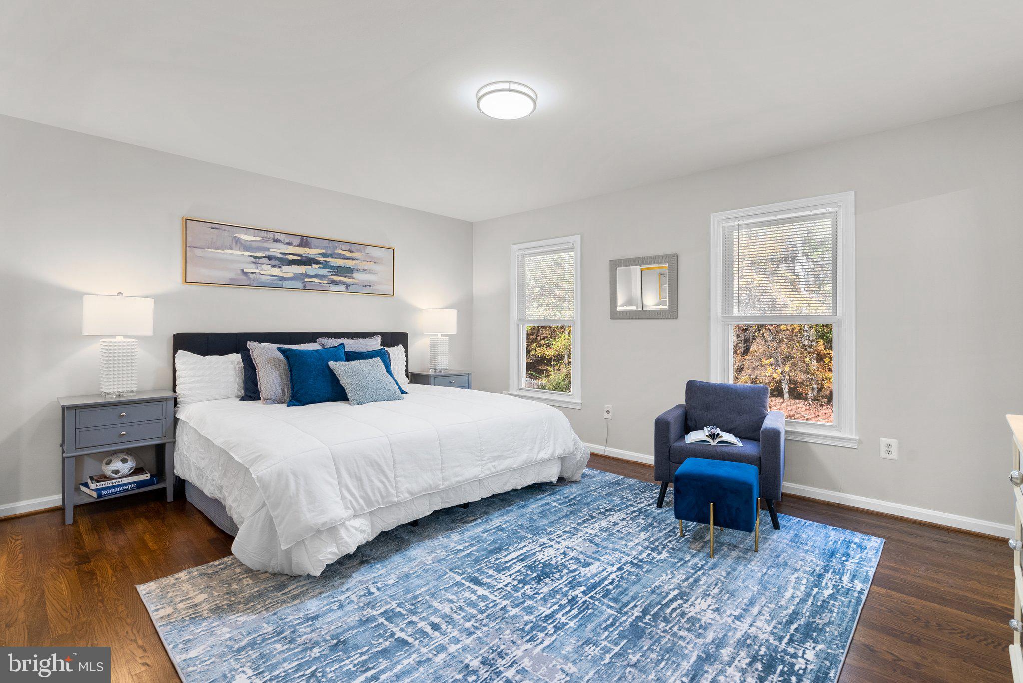 225 Hermleigh Road Silver Spring, MD 20902 - Photo 11 of 29 a bedroom with a bed a couch and a night stand