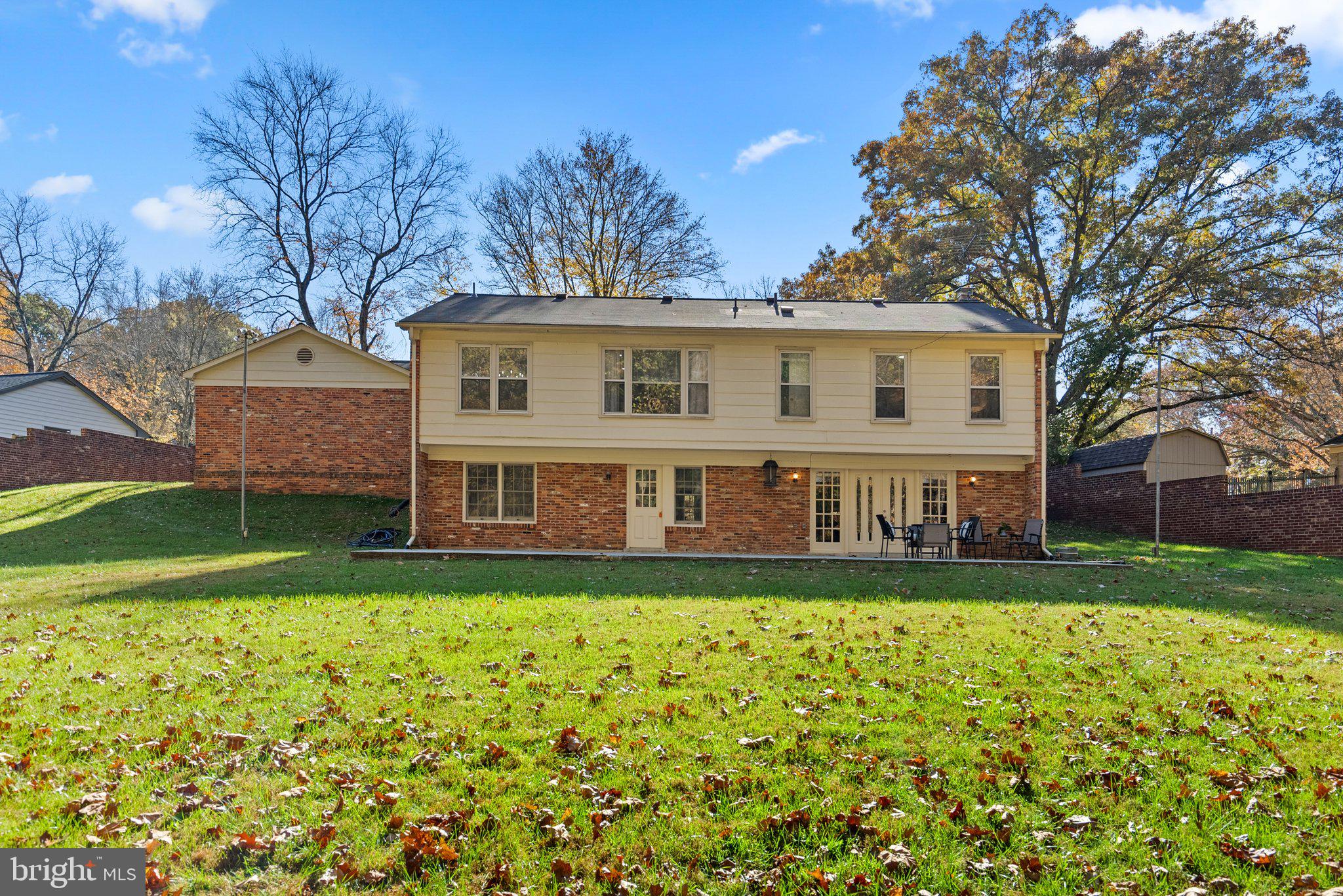 225 Hermleigh Road Silver Spring, MD 20902 - Photo 2 of 29 a view of a house with a big yard and large trees