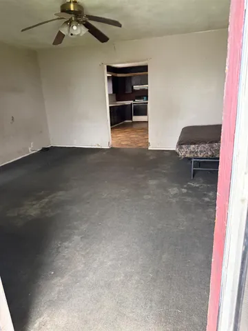 a kitchen with stainless steel appliances kitchen island granite countertop a refrigerator and a sink