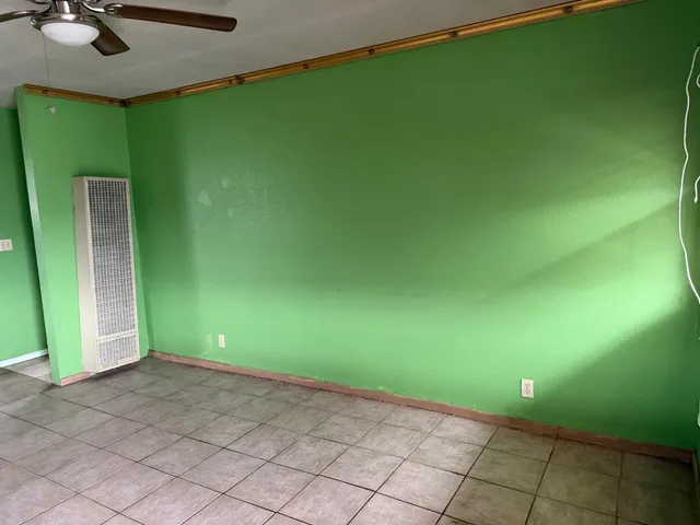 a kitchen with a refrigerator and a stove