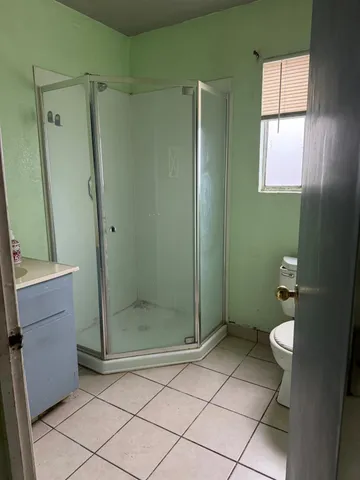 a view of room with walk in closet and window