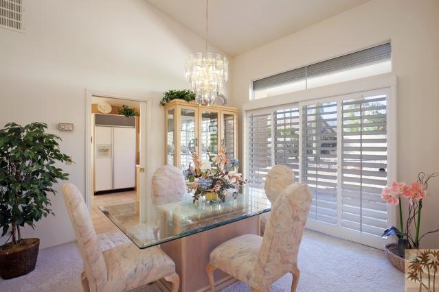 36665 Palmdale Road Rancho Mirage, CA 92270 - Photo 8 of 25 a dining room with furniture and large windows