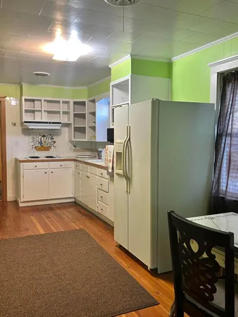 a kitchen with stainless steel appliances a refrigerator and a stove
