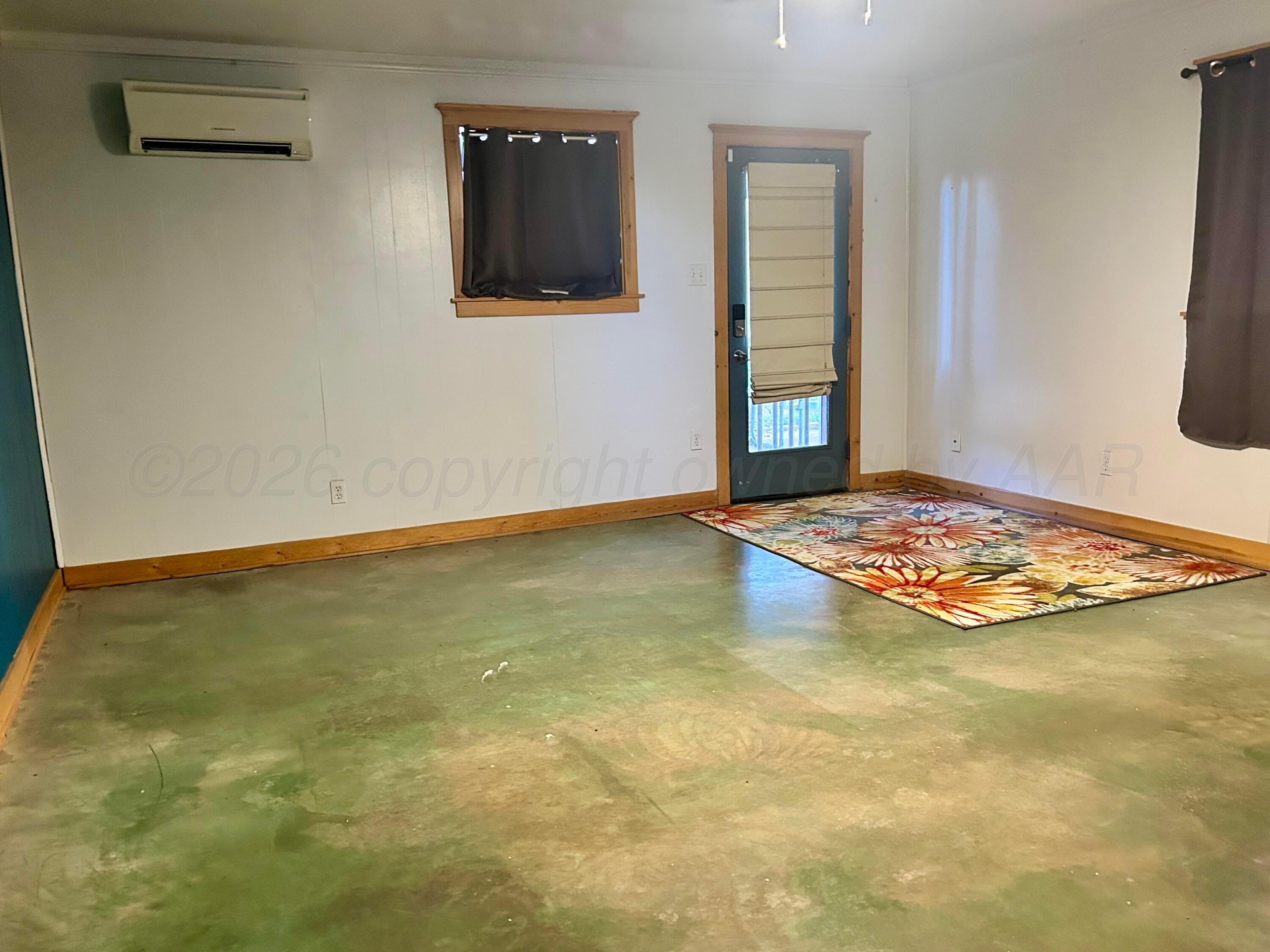 1426 South Main Street Canadian, TX 79014 - Photo 21 of 26 a view of an empty room with window and fireplace