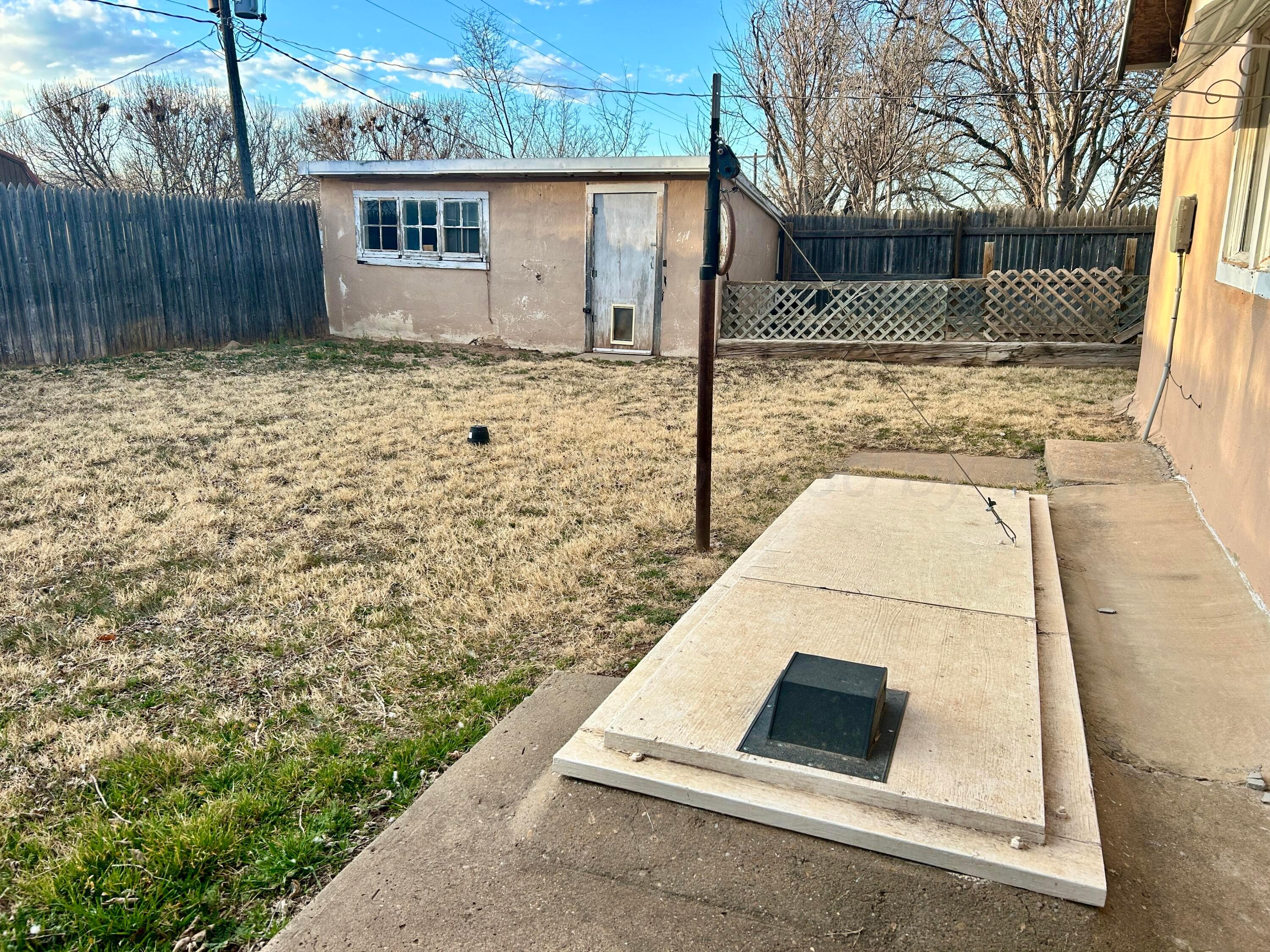 1426 South Main Street Canadian, TX 79014 - Photo 25 of 26 a white house that has tree in front of it