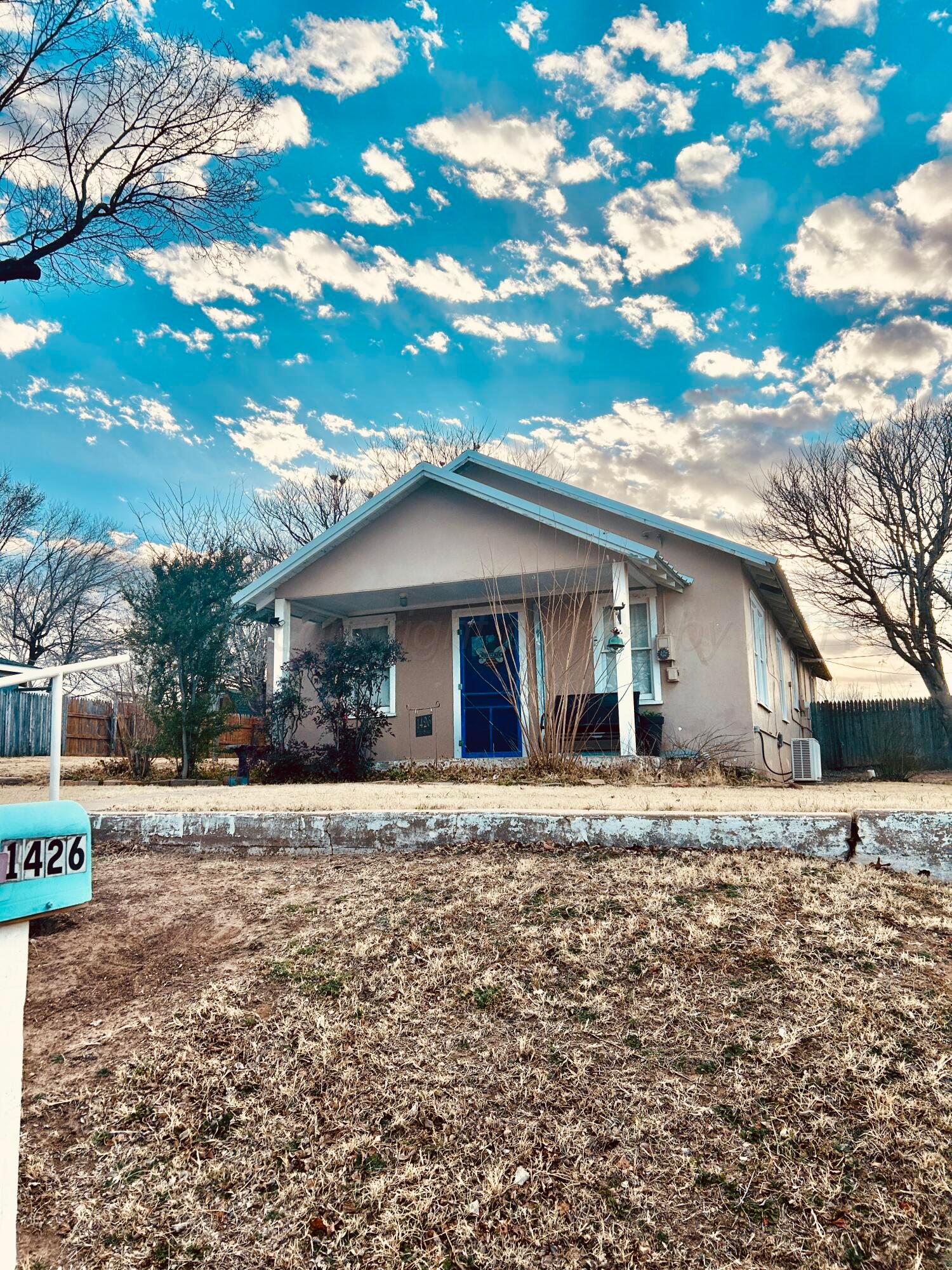 1426 South Main Street Canadian, TX 79014 - Photo 3 of 26 a front view of a house with a yard