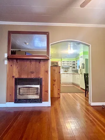 a living room with a fireplace a flat screen tv and a fireplace