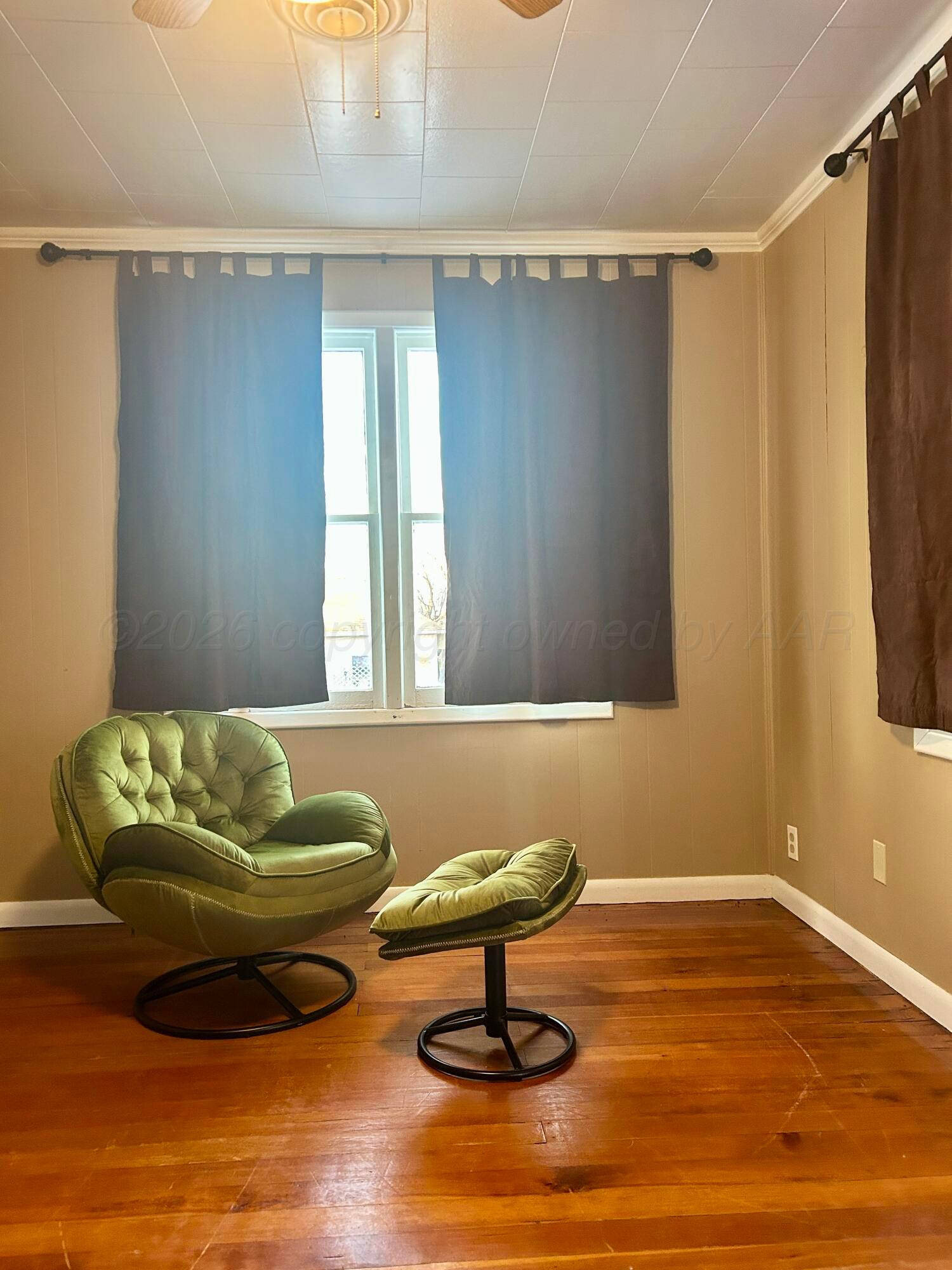1426 South Main Street Canadian, TX 79014 - Photo 9 of 26 a living room with furniture and a window
