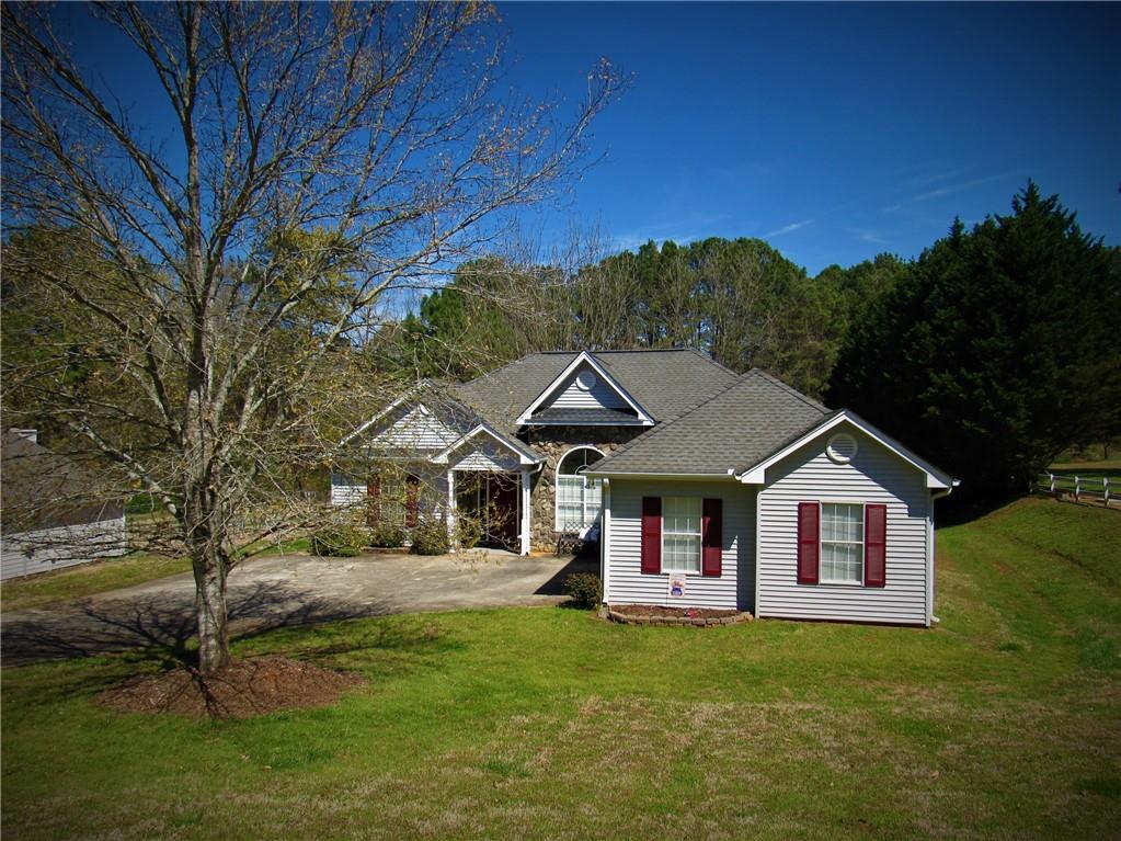 a front view of a house with garden