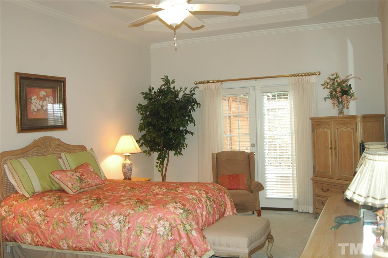 7316 Fontana Ridge Lane Raleigh, NC 27613 - Photo 13 of 20 Spacious first floor master bedroom with French doors to outside decking area