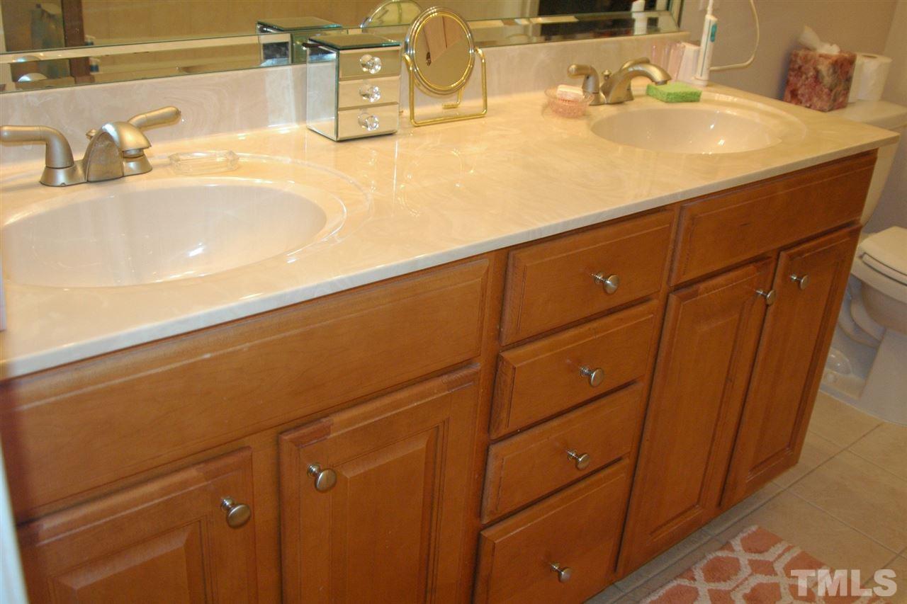 7316 Fontana Ridge Lane Raleigh, NC 27613 - Photo 15 of 20 Kitchen height double vanity in owners bath, tile floors, whirlpool tub sep shower, access to large walk in closet