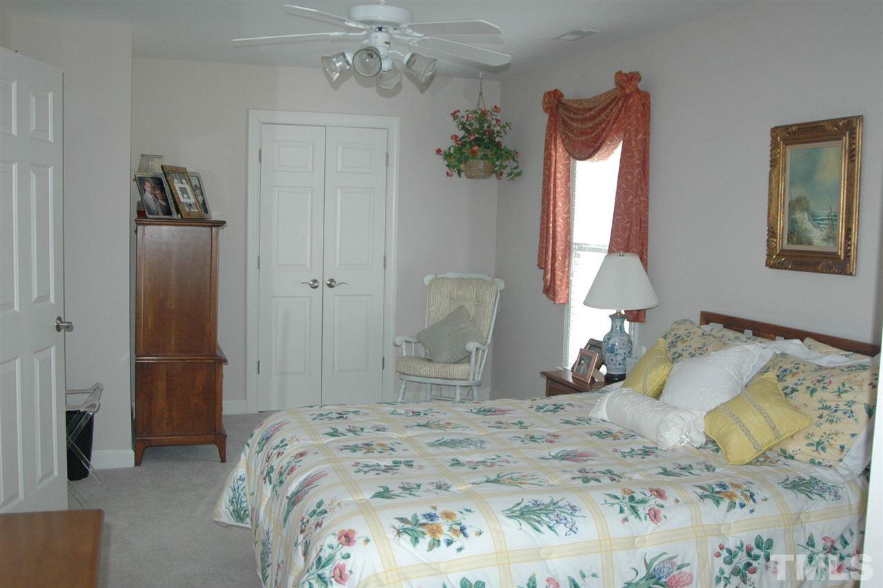 7316 Fontana Ridge Lane Raleigh, NC 27613 - Photo 19 of 20 Guest bedroom with walk-in closet and walk-in storage