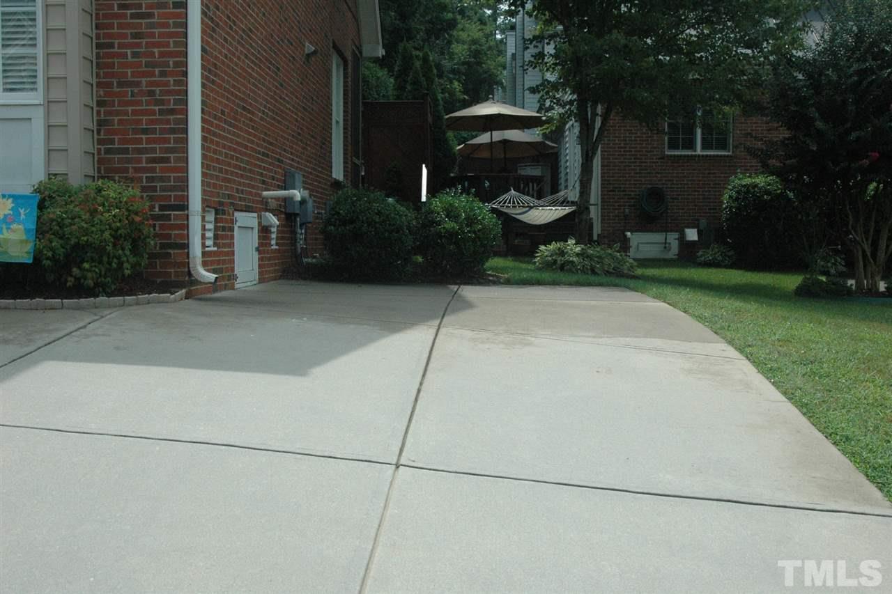 7316 Fontana Ridge Lane Raleigh, NC 27613 - Photo 4 of 20 You can never have enough parking in a townhome community. Seller paid extra to have the separate parking pad added during construction