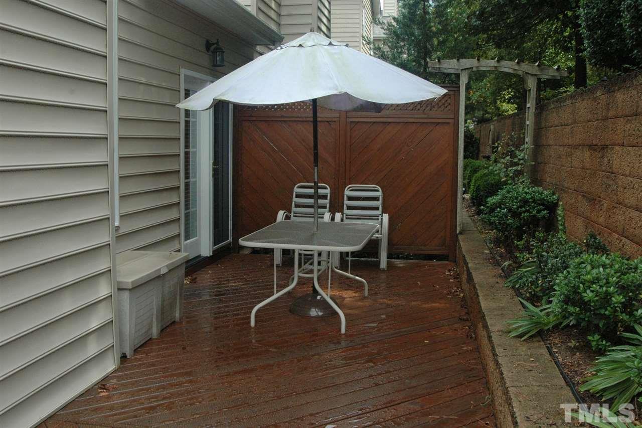 7316 Fontana Ridge Lane Raleigh, NC 27613 - Photo 6 of 20 Seller optioned to have the deck extended the length of the home. Also added outside access from the first floor owners suite