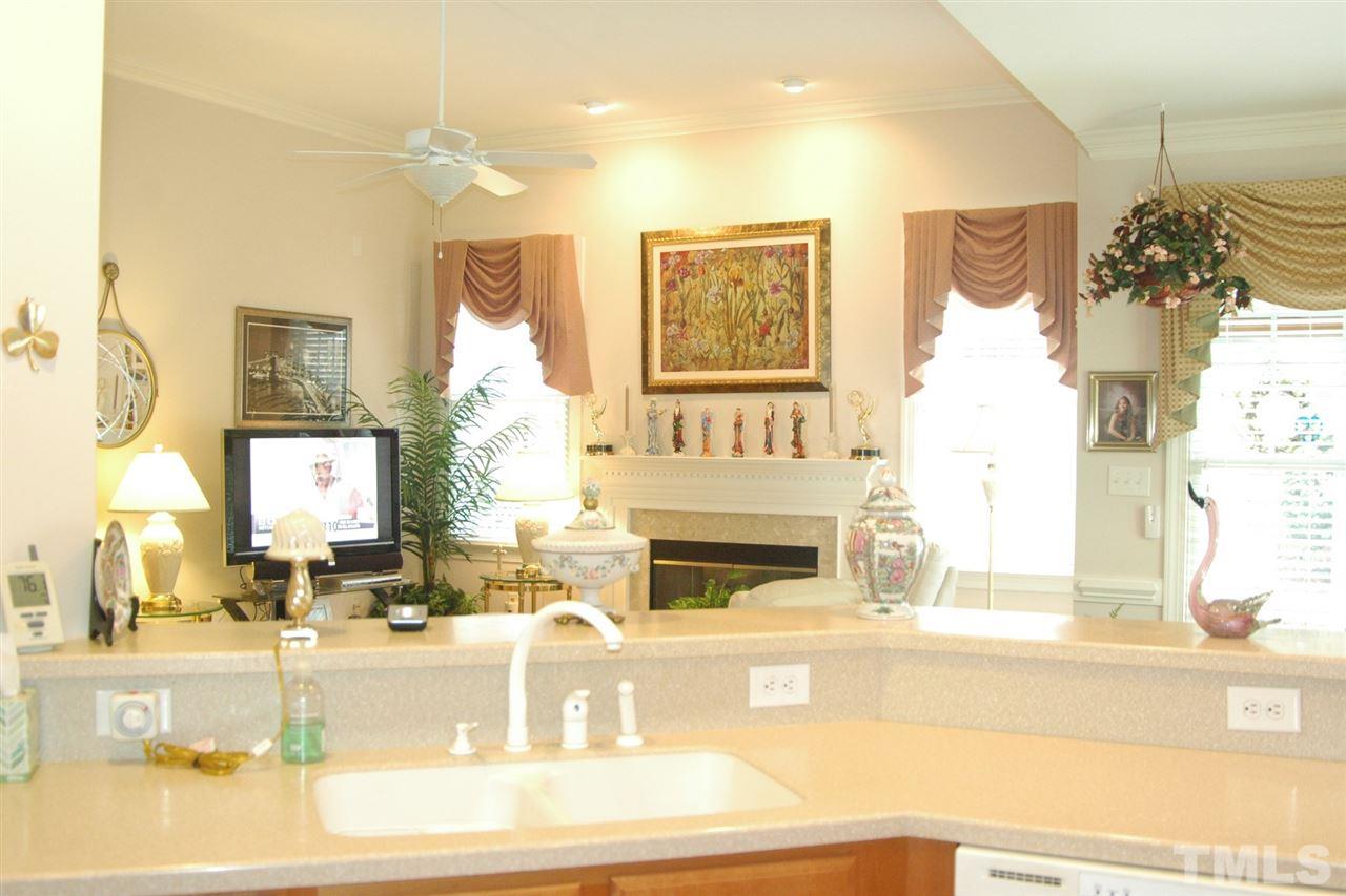 7316 Fontana Ridge Lane Raleigh, NC 27613 - Photo 10 of 20 View from behind the kitchen bartop counter into the open family room