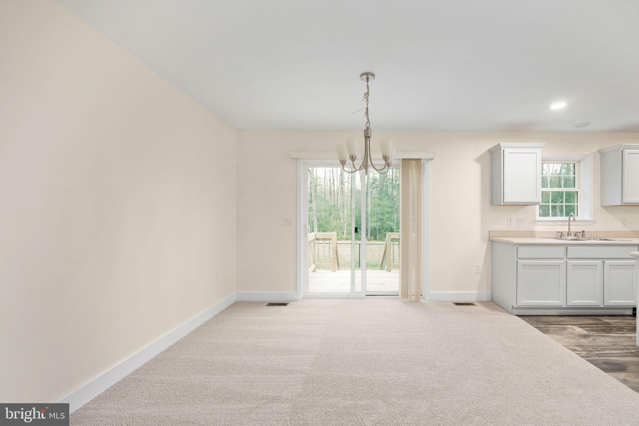 300 River Oaks Road Center Cross, VA 22437 - Photo 12 of 39 a view of a kitchen with a sink cabinets and a wooden floor