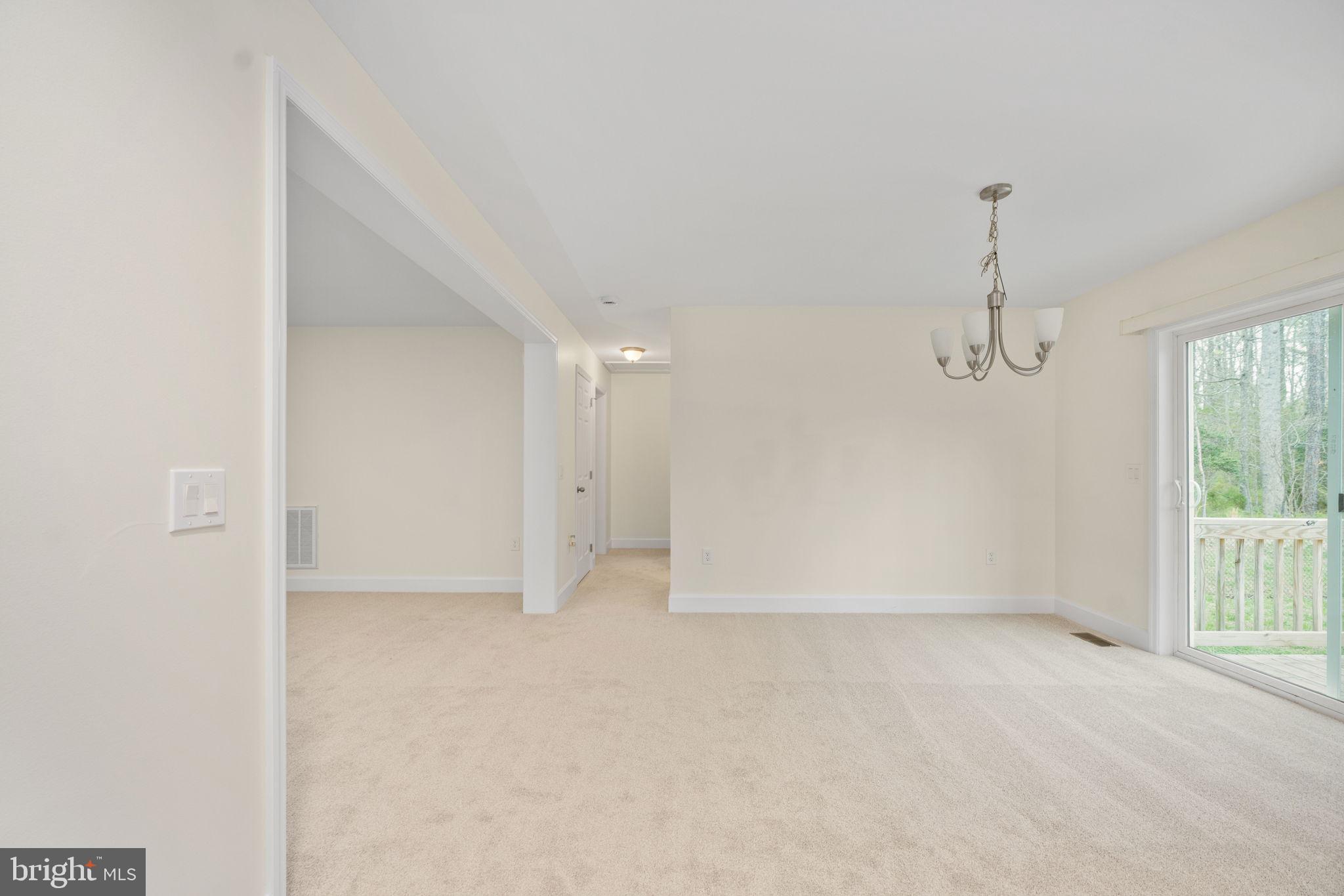 300 River Oaks Road Center Cross, VA 22437 - Photo 13 of 39 an empty room with windows