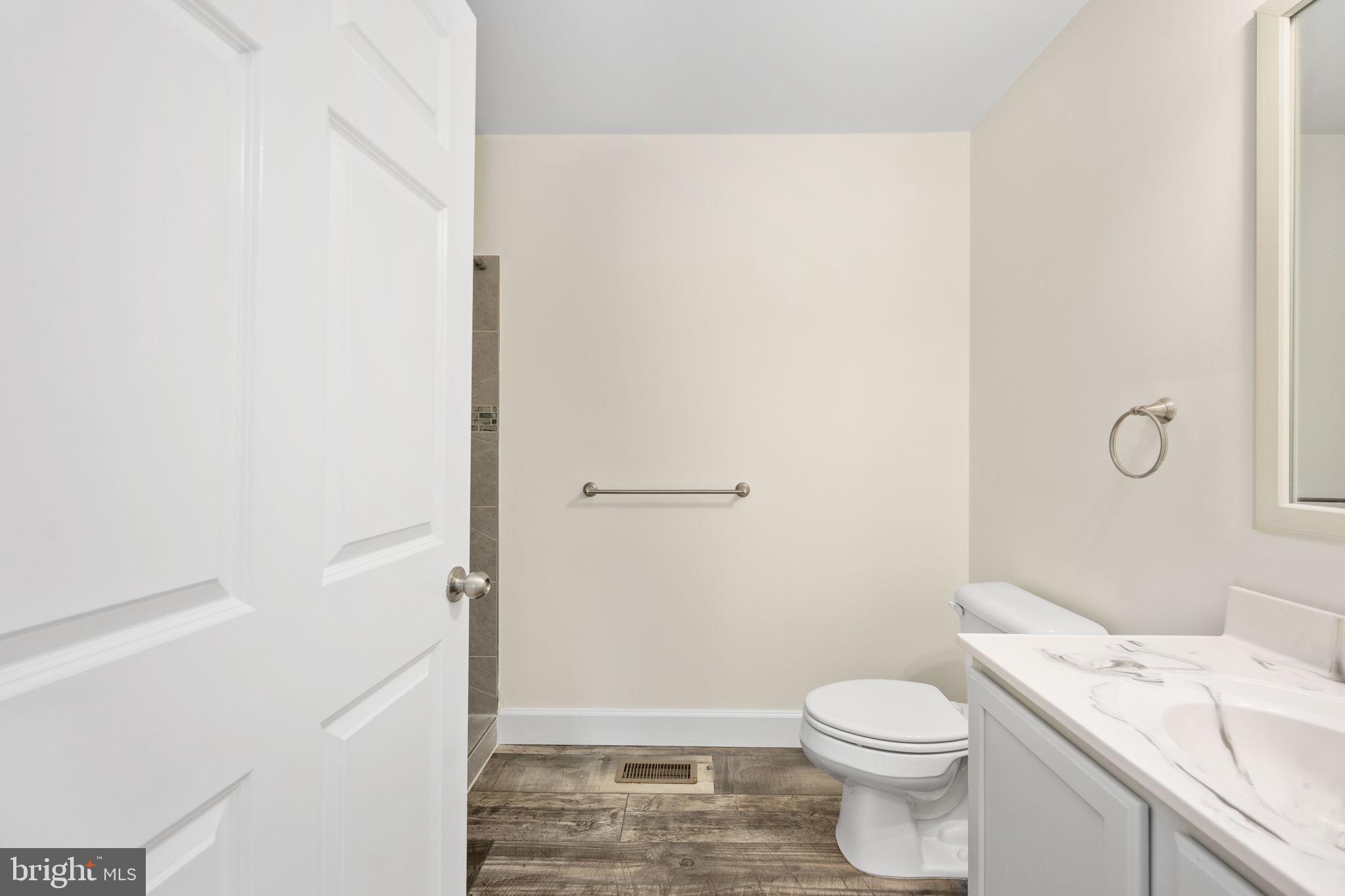 300 River Oaks Road Center Cross, VA 22437 - Photo 27 of 39 a white toilet sitting next to a bathroom sink