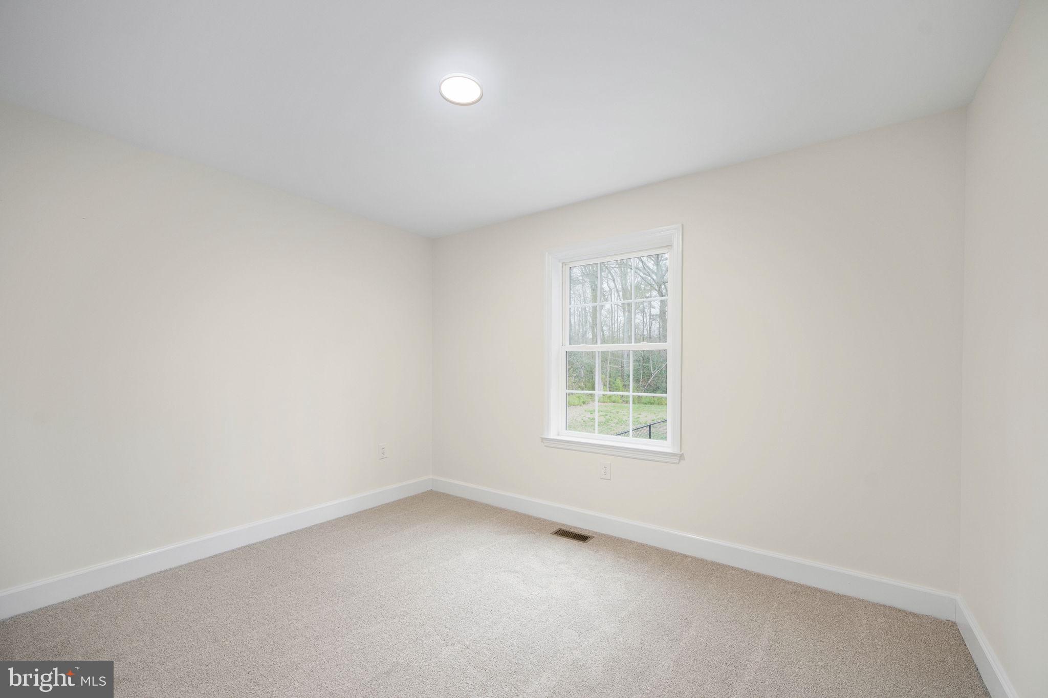 300 River Oaks Road Center Cross, VA 22437 - Photo 34 of 39 an empty room with a window