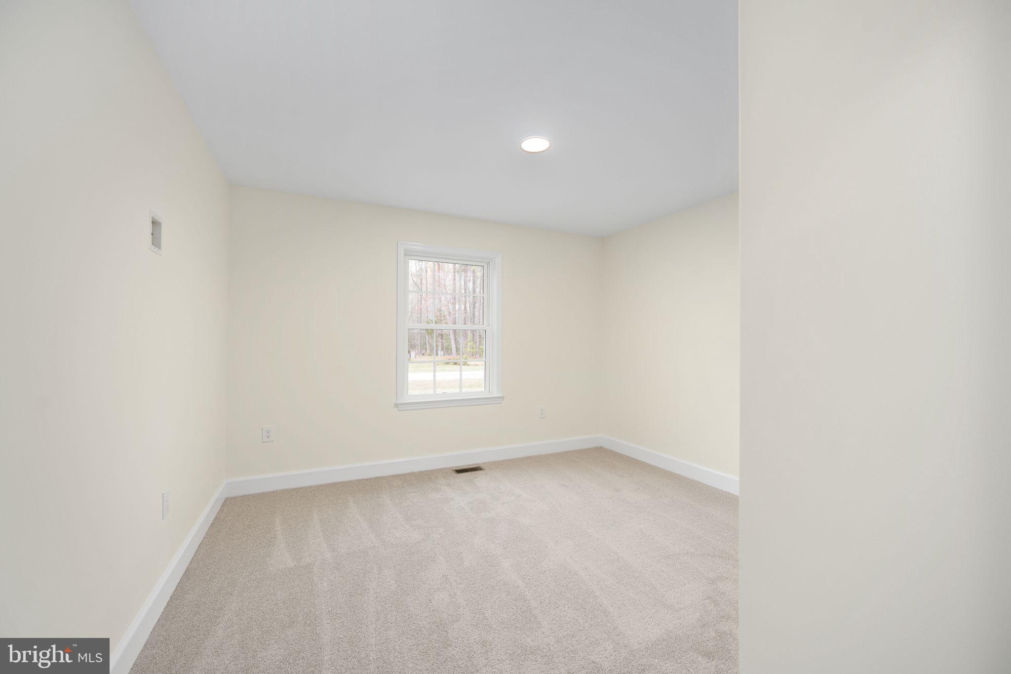 300 River Oaks Road Center Cross, VA 22437 - Photo 36 of 39 an empty room with a window