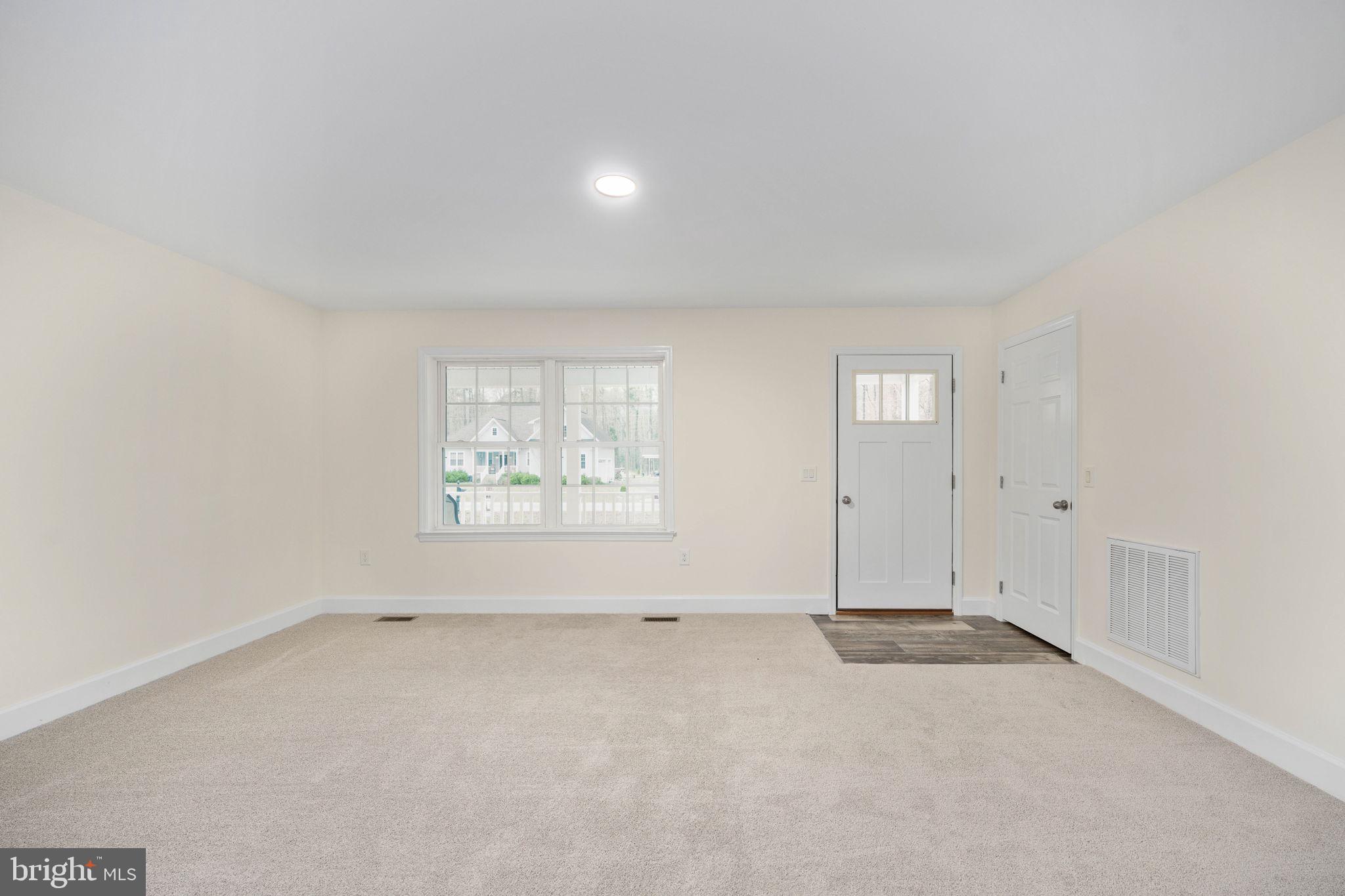 300 River Oaks Road Center Cross, VA 22437 - Photo 8 of 39 an empty room with windows