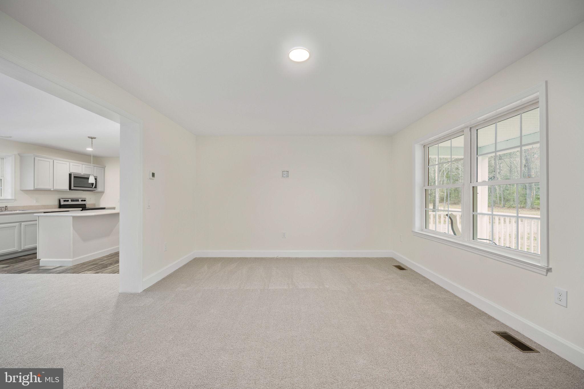 300 River Oaks Road Center Cross, VA 22437 - Photo 9 of 39 Bright and airy open space awaits.