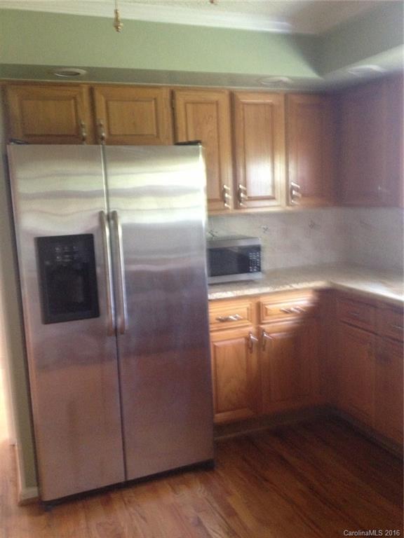 1032 Snyders Store Road, Unit 5 Wingate, NC 28174 - Photo 5 of 7 a picture of a glass door with a kitchen