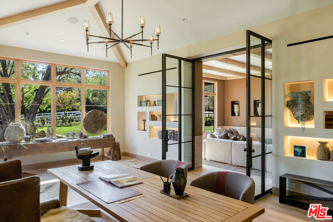 24877 Eldorado Meadow Road Hidden Hills, CA 91302 - Photo 17 of 46 a living room with furniture and a floor to ceiling window