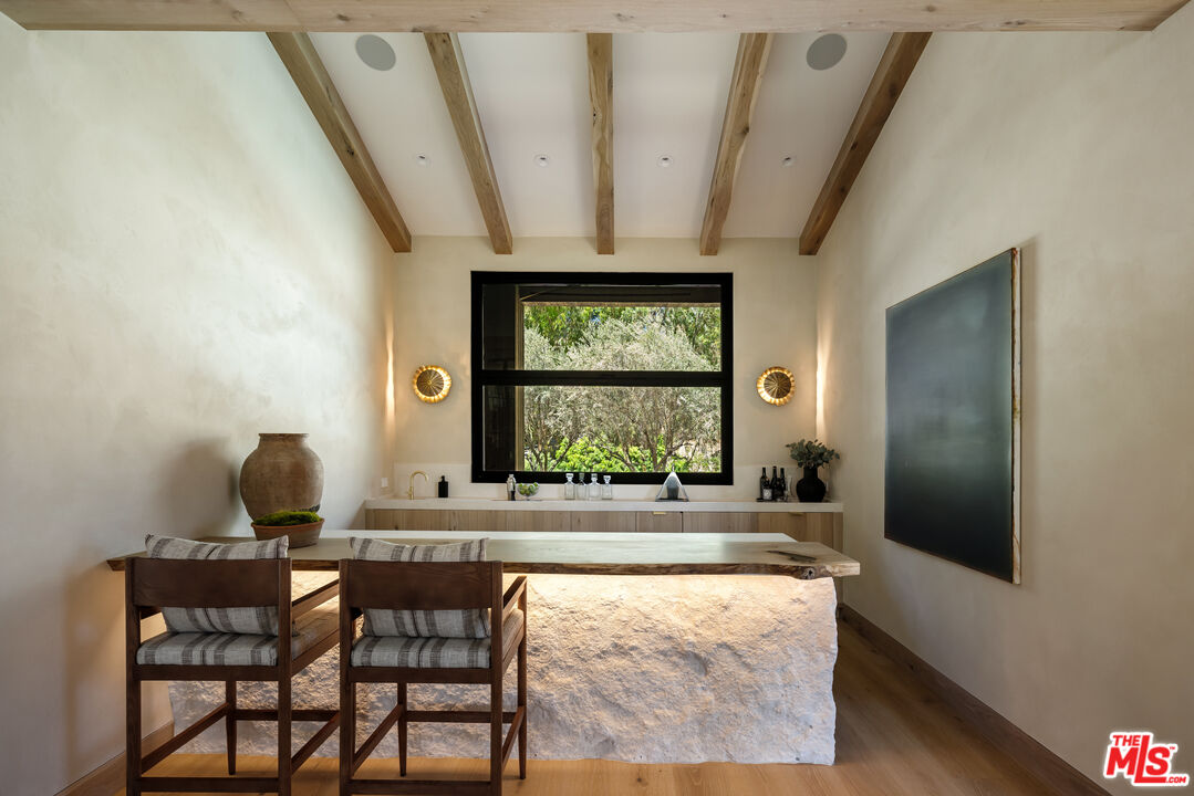 24877 Eldorado Meadow Road Hidden Hills, CA 91302 - Photo 18 of 46 a room with a window and chairs