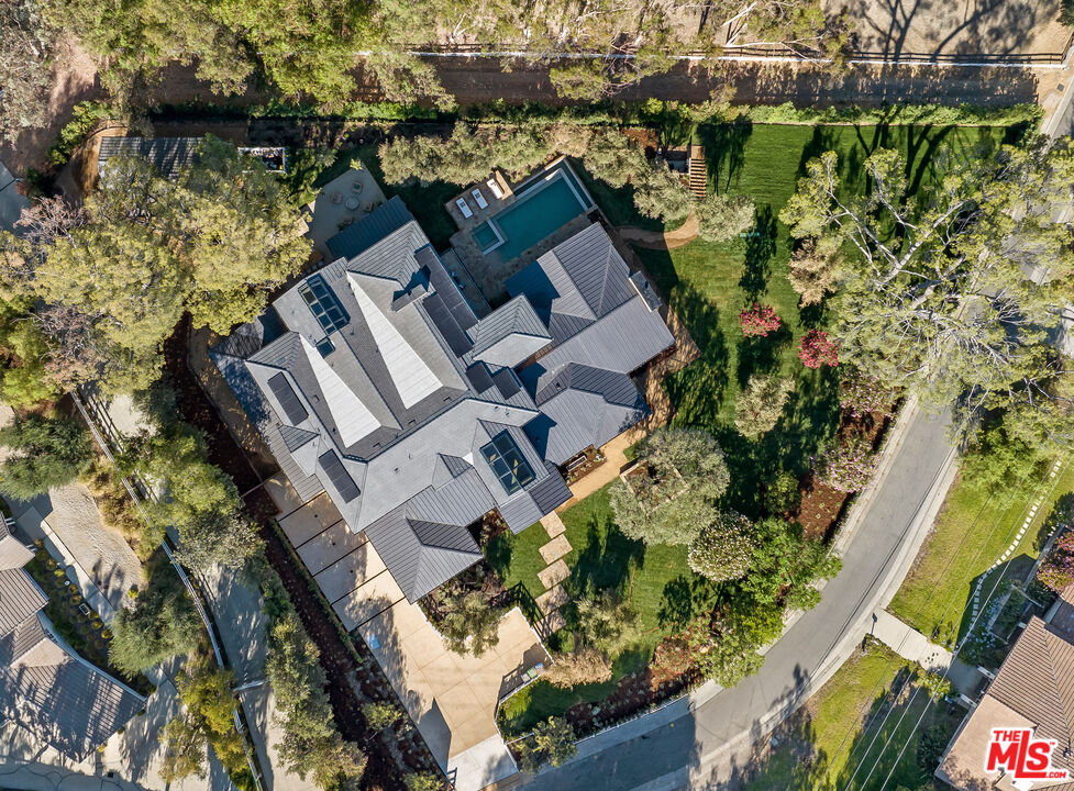 24877 Eldorado Meadow Road Hidden Hills, CA 91302 - Photo 2 of 46 an aerial view of a house with a lake view