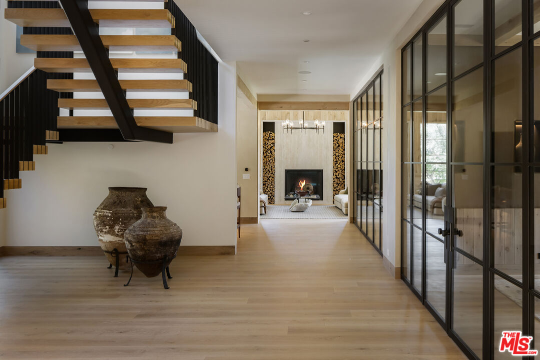 24877 Eldorado Meadow Road Hidden Hills, CA 91302 - Photo 21 of 46 a living room with furniture and a fireplace