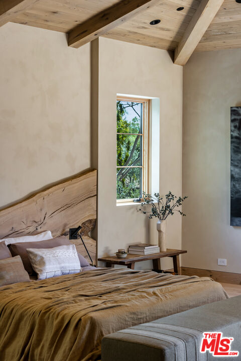 24877 Eldorado Meadow Road Hidden Hills, CA 91302 - Photo 25 of 46 a bedroom with a bed and a window