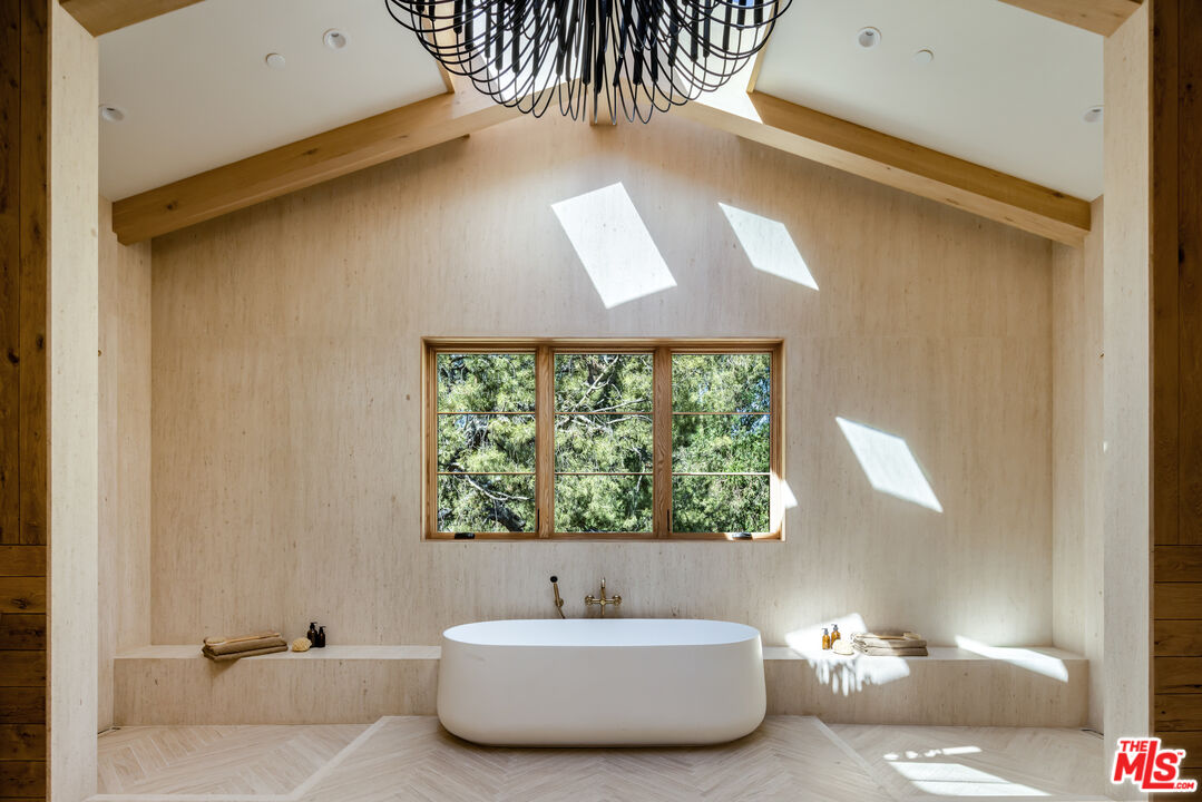 24877 Eldorado Meadow Road Hidden Hills, CA 91302 - Photo 26 of 46 a bathroom with a bathtub and a window