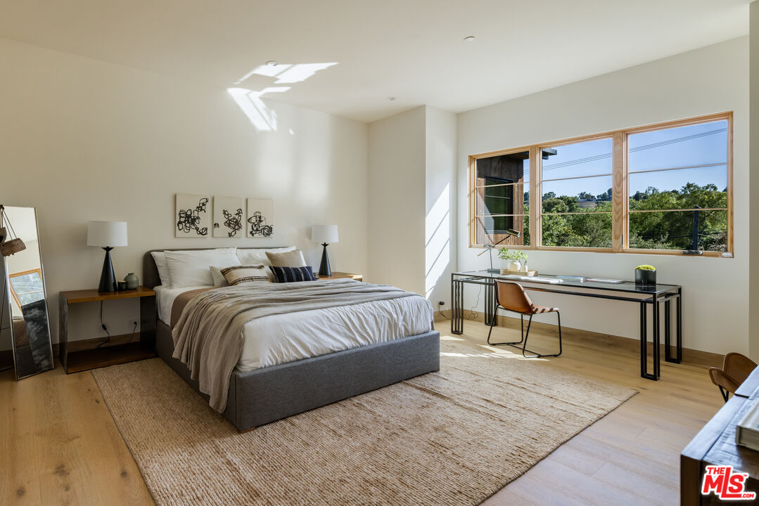 24877 Eldorado Meadow Road Hidden Hills, CA 91302 - Photo 33 of 46 a bedroom with a bed and a night stand