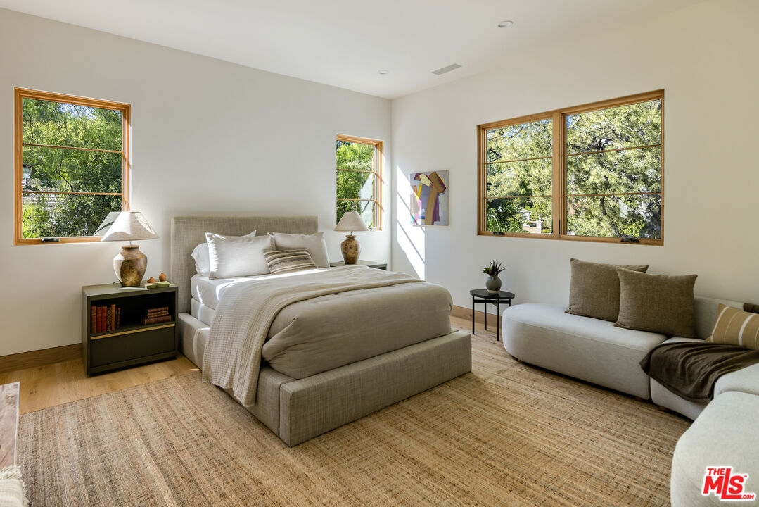 24877 Eldorado Meadow Road Hidden Hills, CA 91302 - Photo 34 of 46 a bedroom with furniture and a large window