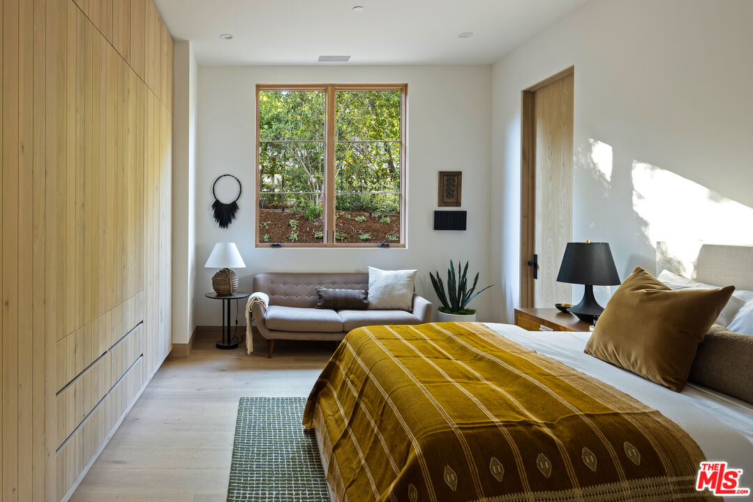 24877 Eldorado Meadow Road Hidden Hills, CA 91302 - Photo 35 of 46 a bedroom with a bed and a large window