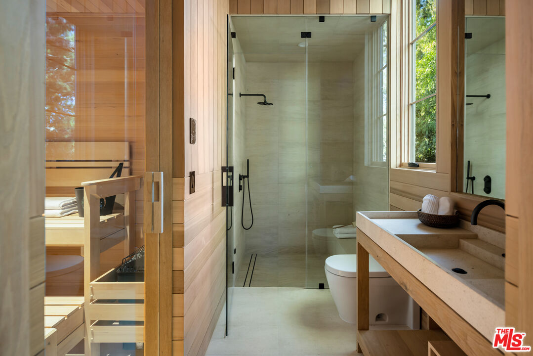 24877 Eldorado Meadow Road Hidden Hills, CA 91302 - Photo 37 of 46 a bathroom with a sink a toilet and shower