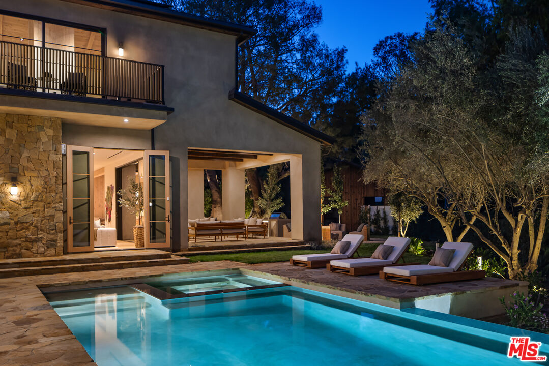 24877 Eldorado Meadow Road Hidden Hills, CA 91302 - Photo 43 of 46 a view of a house with pool and sitting area