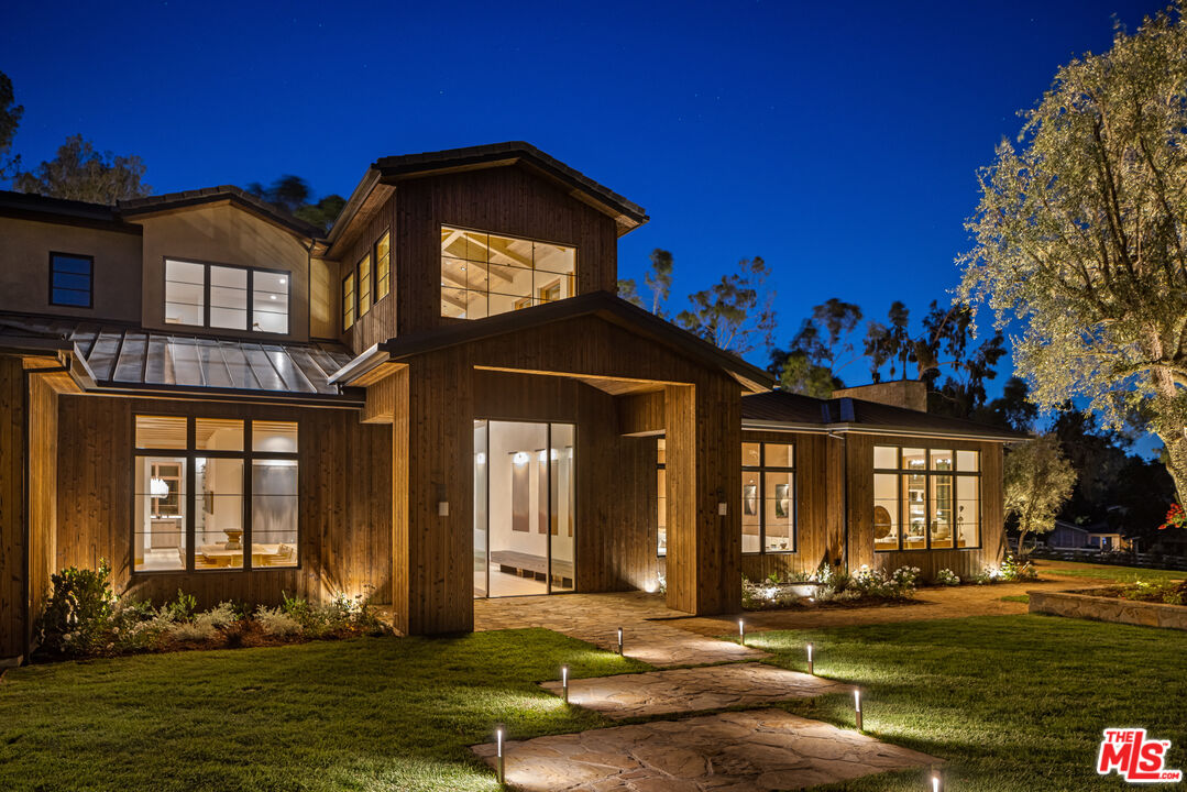 24877 Eldorado Meadow Road Hidden Hills, CA 91302 - Photo 46 of 46 a front view of a house with a yard