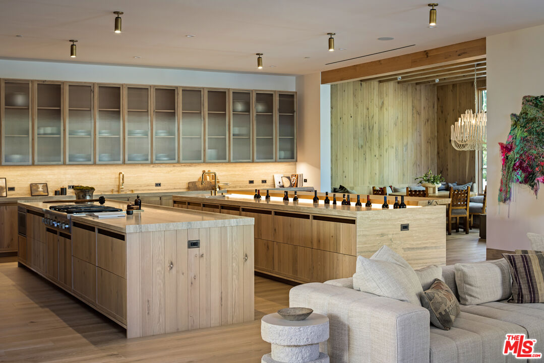 24877 Eldorado Meadow Road Hidden Hills, CA 91302 - Photo 10 of 46 a kitchen with granite countertop a sink stove and cabinets
