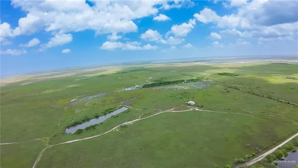 a view of a field with clear sky