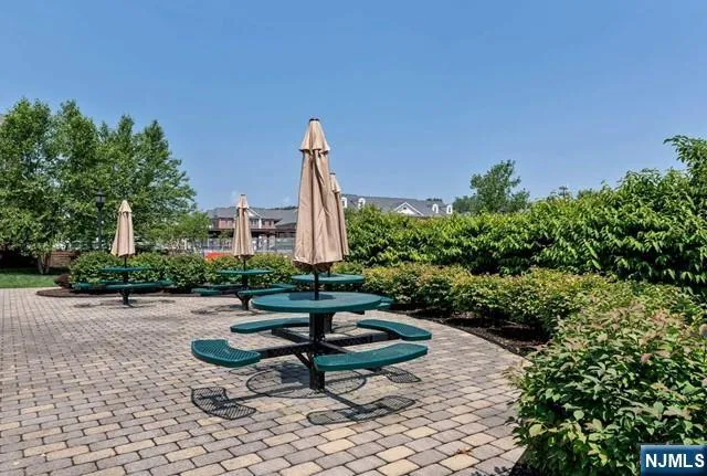 a view of a backyard with sitting area