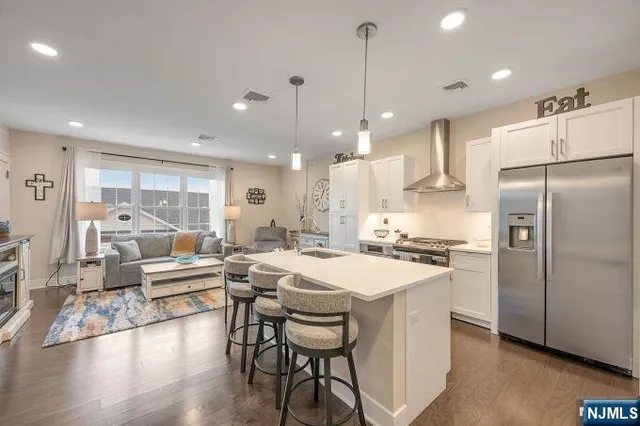 a large kitchen with a table and chairs
