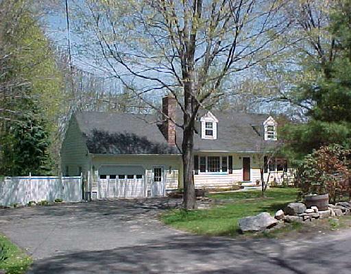 35 Maple Shade Road Ridgefield, CT 06877 - Photo 1 of 1 a front view of a house with a garden