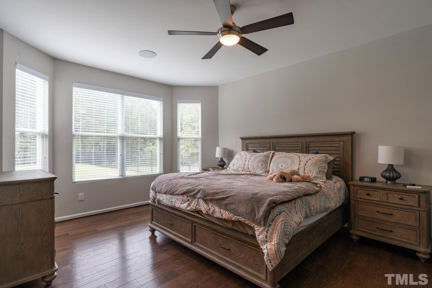3565 Massey Ridge Court Raleigh, NC 27616 - Photo 14 of 22 a bedroom with a large bed and a window