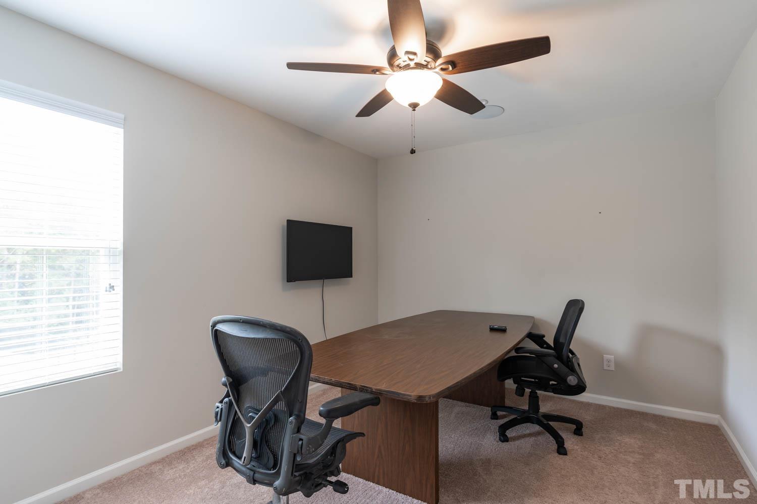 3565 Massey Ridge Court Raleigh, NC 27616 - Photo 20 of 22 a view of a workspace with furniture and a window