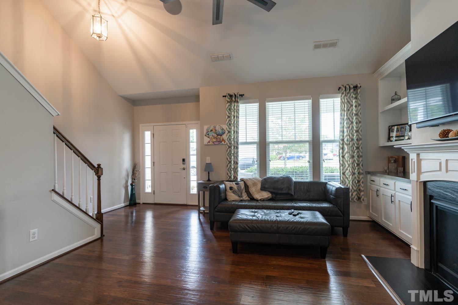 3565 Massey Ridge Court Raleigh, NC 27616 - Photo 4 of 22 a living room with furniture and a fireplace