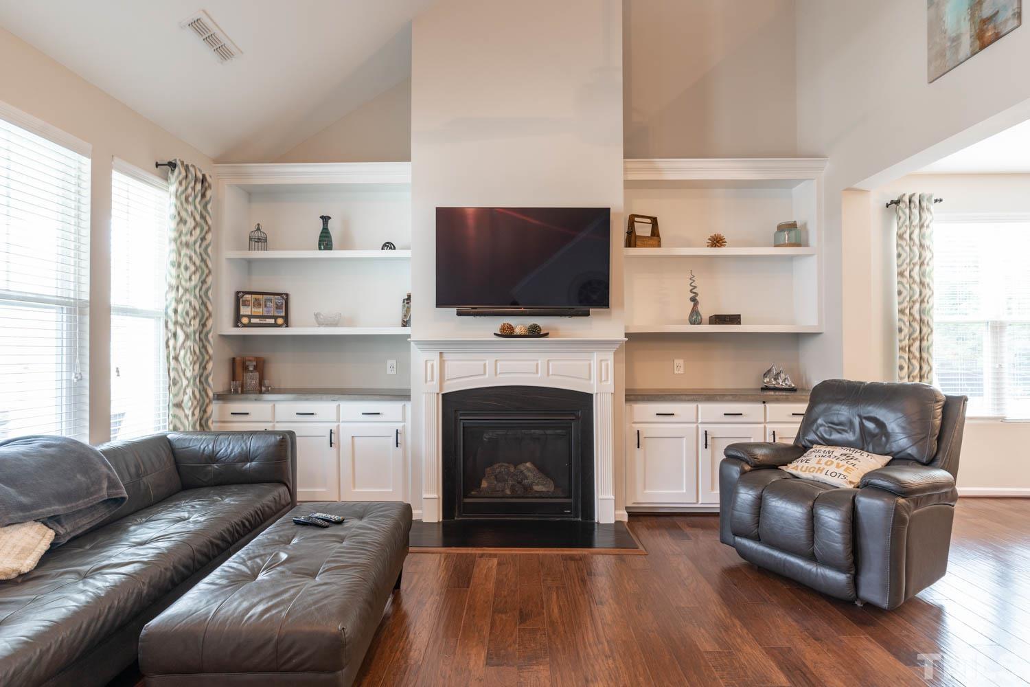 3565 Massey Ridge Court Raleigh, NC 27616 - Photo 6 of 22 a living room with furniture fireplace and flat screen tv