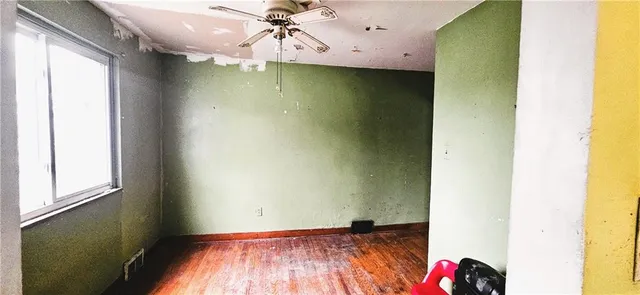 a room with a stove and a refrigerator